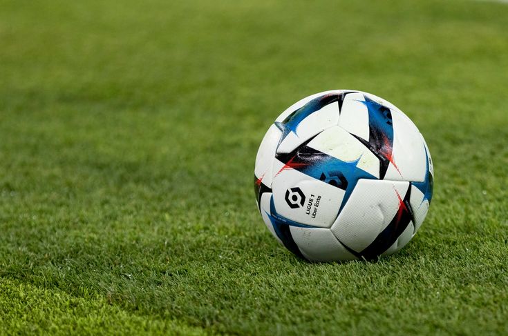 Match ball resting on the grass